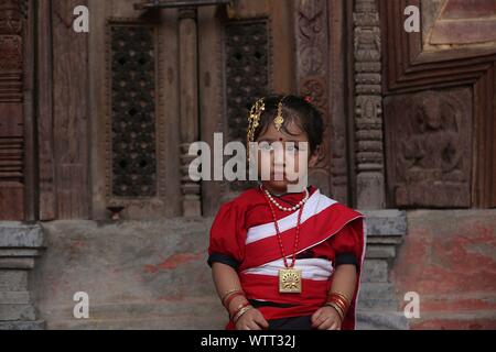 Kathmandu, Nepal. 11th Sep, 2019. A small girl attends Kumari Puja procession organized on occasion of Indrajatra festival in Kathmandu. Hundreds of small girls participated in Kumari Puja or girls mass worship ceremony for better health and good fortune. Credit: Pacific Press Agency/Alamy Live News Stock Photo