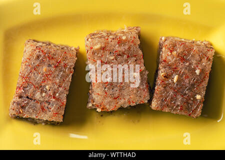 Pieces of Sheki halva on a plate. Eastern sweets Stock Photo