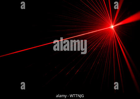 Red laser beam light effect on black background Stock Photo