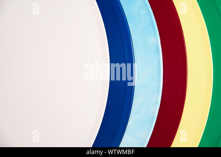 Vintage colored vinyl records collection on a white background with copy space. Top view. Stock Photo