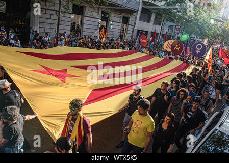 Barcelona, Spain. 11th Sep, 2019. Protesters hold a large independence flag through the demonstration on the National Day of Catalonia, which has been organized by the Catalan National Assembly. Credit: SOPA Images Limited/Alamy Live News Stock Photo