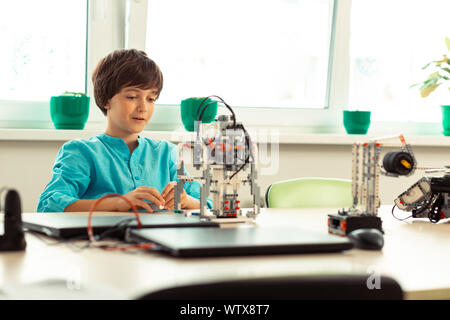 Pupil being in raptures at his school lesson. Stock Photo