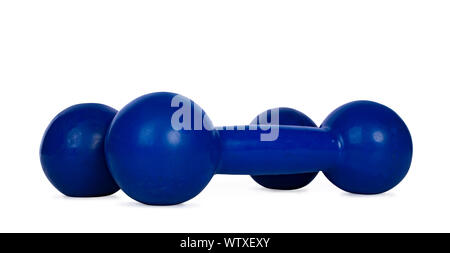 Close up studio shot of set of blue dumbells, isolated on white background. Stock Photo