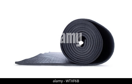 Close up studio shot of rolled op yoga mat, side view. Isolated on white background. Stock Photo
