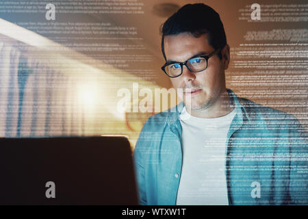 Pensive man using laptop till night at home Stock Photo