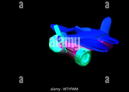 toy yellow plane with screw closeup isolate on a white background. Macro Stock Photo