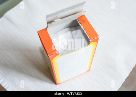 Baking soda in a paper box. Branded packaging of soda in the kitchen Stock Photo