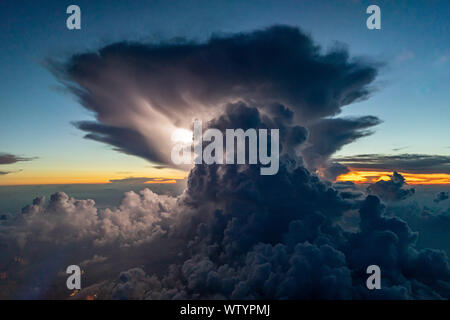 Intense Thunderstorm with lightning during sunset Stock Photo
