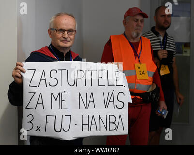 Prague, Czech Republic. 12th Sep, 2019. Opposing to cover the statue of Soviet Marshal Ivan Konev, left, attends Prague 6 Assembly meeting to debate the statue, on September 12, 2019, in Prague, Czech Republic. Credit: Ondrej Deml/CTK Photo/Alamy Live News Stock Photo