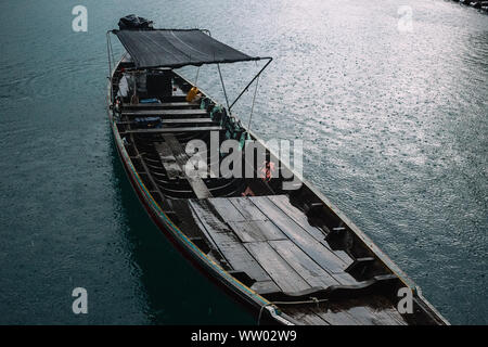 Long tail boat. boat on the lake in a rainy day in thailand's old rain forest. Canoe trip on Cheow Lan Lake Stock Photo