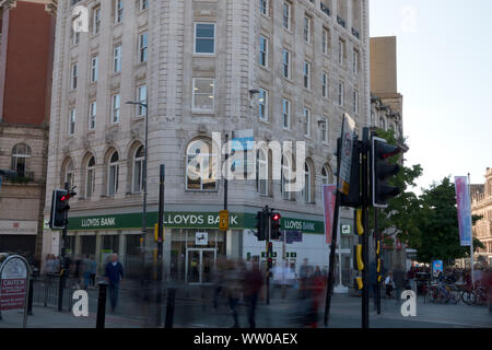 Daytime long exposure of people walking past a Lloyds Bank on Church St Liverpool Stock Photo