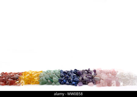 Healing Chakra Crystals Banner - Chakra colored tumbled healing stones. Crystal healing background Stock Photo