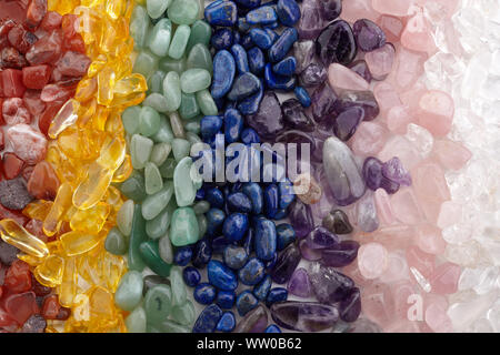 Healing Chakra Crystals Banner - Chakra colored tumbled healing stones. Crystal healing background Stock Photo