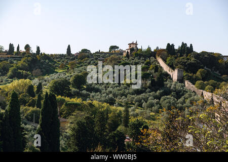 Old fortification walls of Florence, Italy. View of Oltrarno, Boboli Gardens, Fortress wall and Forte di Belvedere. Stock Photo