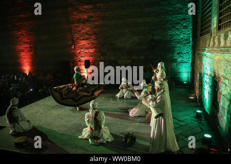 Cairo, Egypt. 11th Sep, 2019. Dancers perform during EL Tanoura show, an Egyptian traditional Sufi dance, at Qubbet Al-Ghouri. Credit: Lobna Tarek/dpa/Alamy Live News Stock Photo