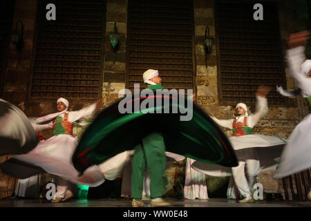 Cairo, Egypt. 11th Sep, 2019. Dancers perform during EL Tanoura show, an Egyptian traditional sufi dance, at Qubbet Al-Ghouri. Credit: Lobna Tarek/dpa/Alamy Live News Stock Photo