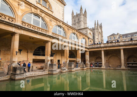 Bath, United Kingdom - November 2, 2017: Tourists visit the Roman baths of Bath, Somerset. One of the most popular landmarks of the city Stock Photo