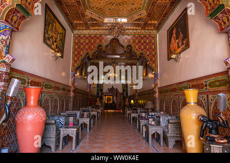 MARRAKESH, MOROCCO - JAN 2019: Inner hall of Riad in Marrakesh, Morocco. Rich riad interior Moroccan style arch stairs and mosaic