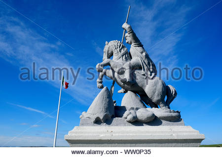 War memorial, a statue of Saint George and the dragon, outside the The Italian Chapel in Orkney Scotland, built by Italian WW2 prisoners Stock Photo