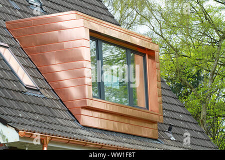 straight copper dormer with large window on rooftop Stock Photo