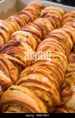 Many freshly backed danish pastries on sale close-up Stock Photo