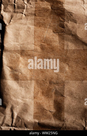 closeup of a wrinkled used brown paper, to use as a background Stock Photo