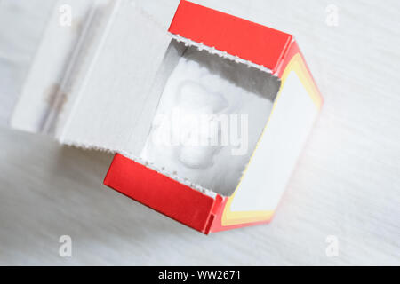 Baking soda in a paper box. Branded packaging of soda in the kitchen Stock Photo