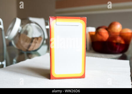 Baking soda in a paper box. Branded packaging of soda in the kitchen Stock Photo