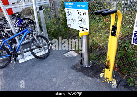 Maidstone, Kent, UK. Bike repair stand and tyre pump on the platform of Maidstone East railway station Stock Photo