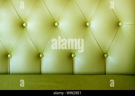 Close up of a carriage tie on a leather sofa, background or concept, selective focus Stock Photo