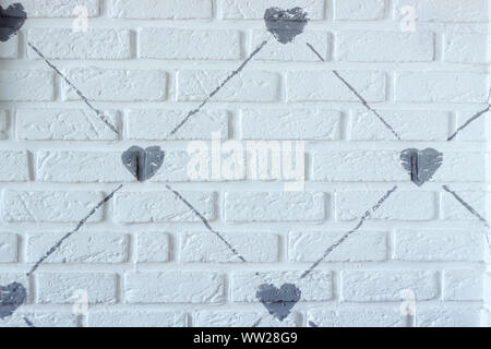 Drawing of gray lines and hearts on white brick wall, background or concept Stock Photo
