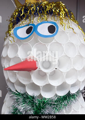 Snowman made of disposable plastic cups Stock Photo
