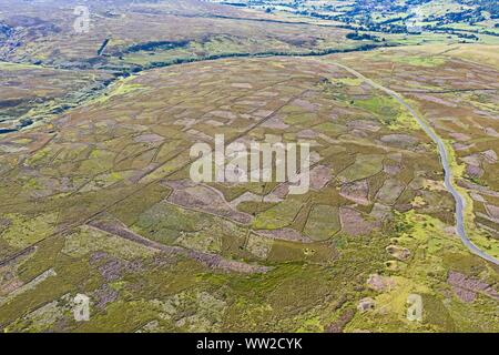 Grinton Moor above Swaledale in Yorkshire Dales, July.  Aerial image showing patchwork pattern where moor has been burnt on rotation for maximising ha Stock Photo