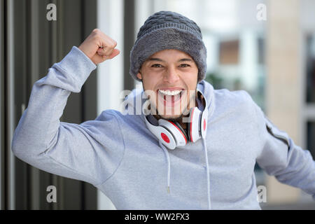 Successful happy young latin man runner jogger sport sports cold winter joy pleasure outdoor Stock Photo