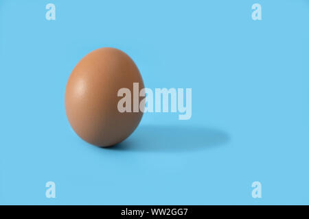 An Eggs isolated on blue background, Eggs is beneficial to the body, Food concept. Stock Photo