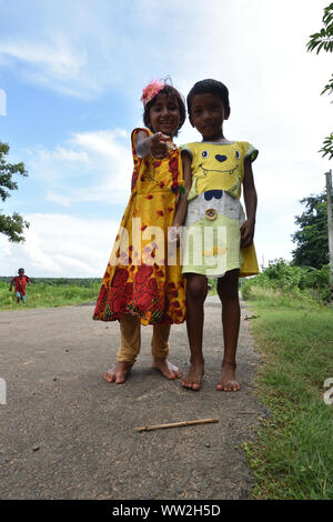 Varefooted two village girls are in standing pose. Jhargram, West Midnapore, India. Stock Photo