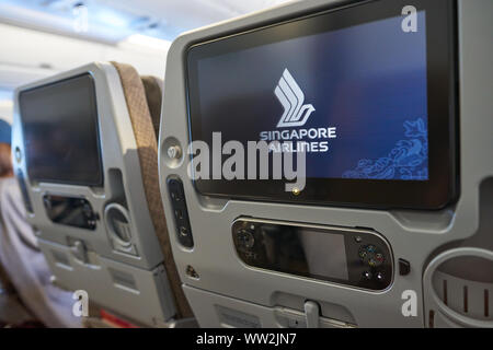 HONG KONG - CIRCA APRIL, 2019: seat back screen in economy class on Singapore Airplines Airbus A350. Stock Photo