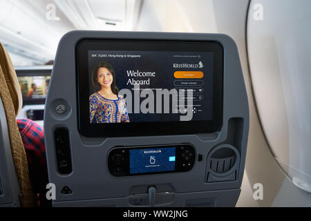 HONG KONG - CIRCA APRIL, 2019: seat back screen in economy class on Singapore Airplines Airbus A350. Stock Photo