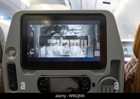 HONG KONG - CIRCA APRIL, 2019: seat back screen in economy class on Singapore Airplines Airbus A350. Stock Photo