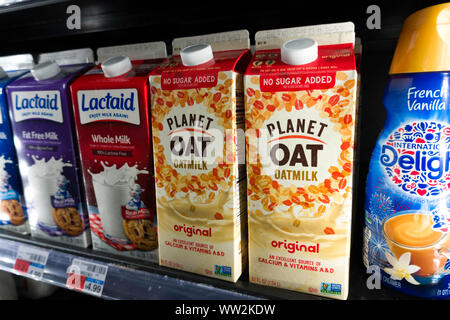 Oatmilk in a dairy section, NYC Stock Photo