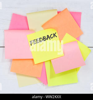 Feedback contact customer service opinion survey review business concept desk note paper notepaper Stock Photo