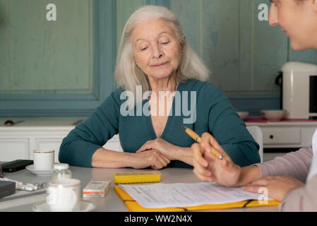 Doctor taking medical history of patient Stock Photo