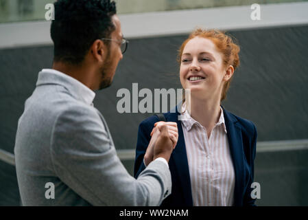 couple holding hands outdoors Stock Photo
