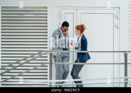 Happy couple standing outdoors Stock Photo