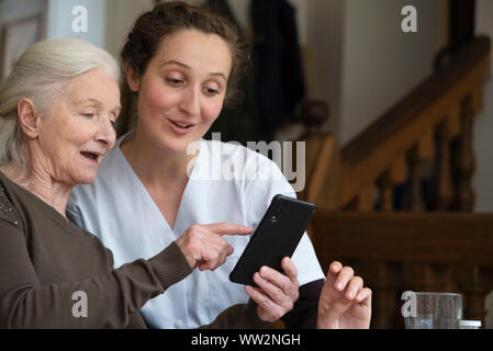 Senior patient using smartphone Stock Photo