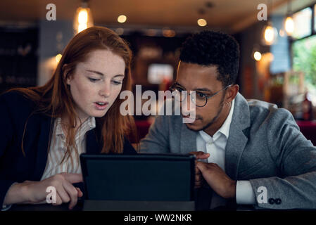Couple using digital tablet Stock Photo