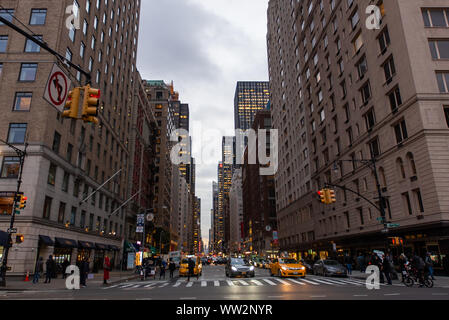 View of city street at dusk Stock Photo