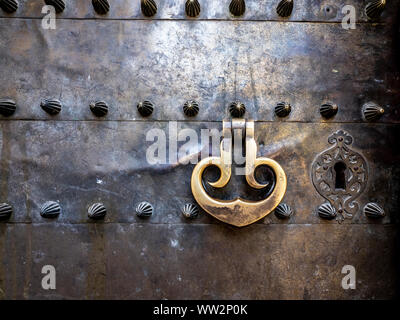 Ancient door with rivets and studs Cordoba Stock Photo