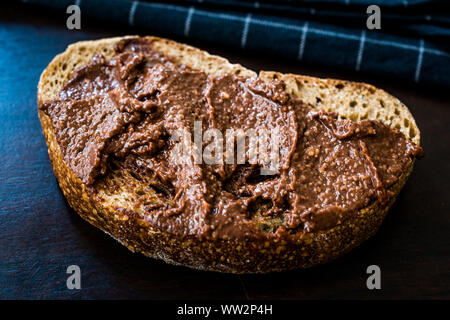 Homemade Cream Chocolate Hazelnut Spread with Bread Slice. Organic Food. Stock Photo