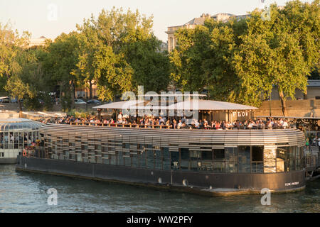 Paris, France - Aug 30, 2019: France, Paris, area listed as World Heritage by UNESCO, the New Berges at Quai d'Orsay with bar barges Flow and Rosa Bon Stock Photo